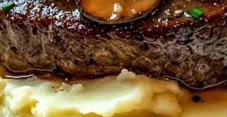 Steak with Mushroom Gravy on Creamy Mashed Potatoes
