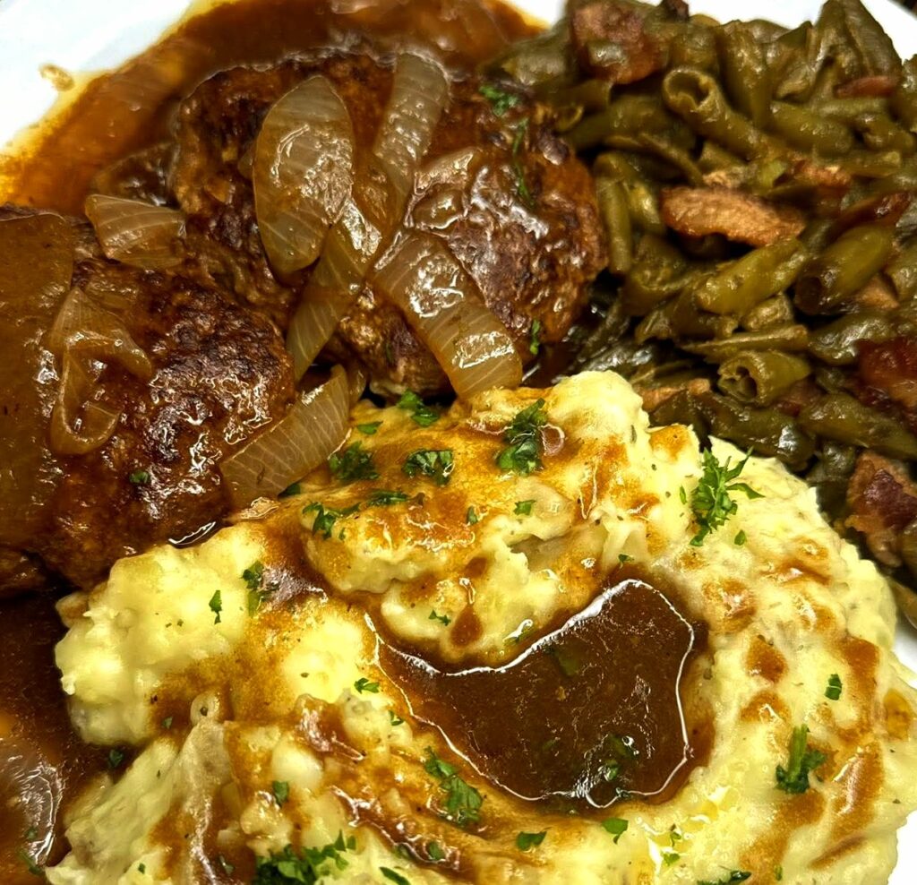 Delicious Salisbury Steak Dinner with Savory Gravy & Green Beans