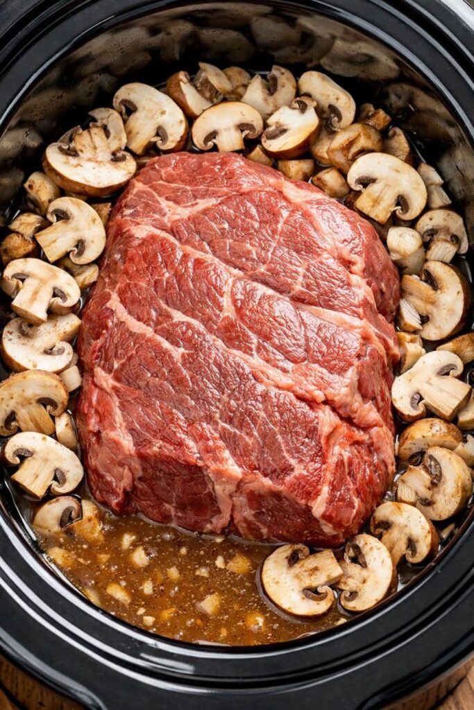 This slow cooker beef roast with mushroom gravy is tender, flavorful, and easy to make